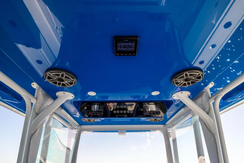 Yacht Photos Pics Interior view of 2022 Freeman 42 LR boat with blue ceiling and speakers.