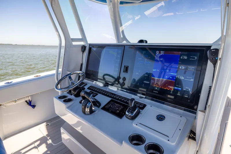  Yacht Photos Pics Freeman 42 LR 2022 boat cockpit with advanced navigation system and steering wheel.