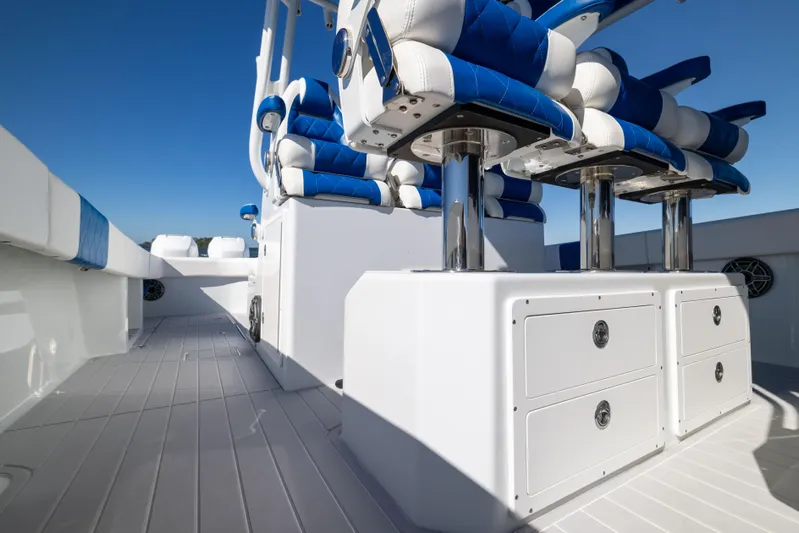  Yacht Photos Pics Freeman 42 LR 2022 boat interior with blue and white seating and storage drawers.