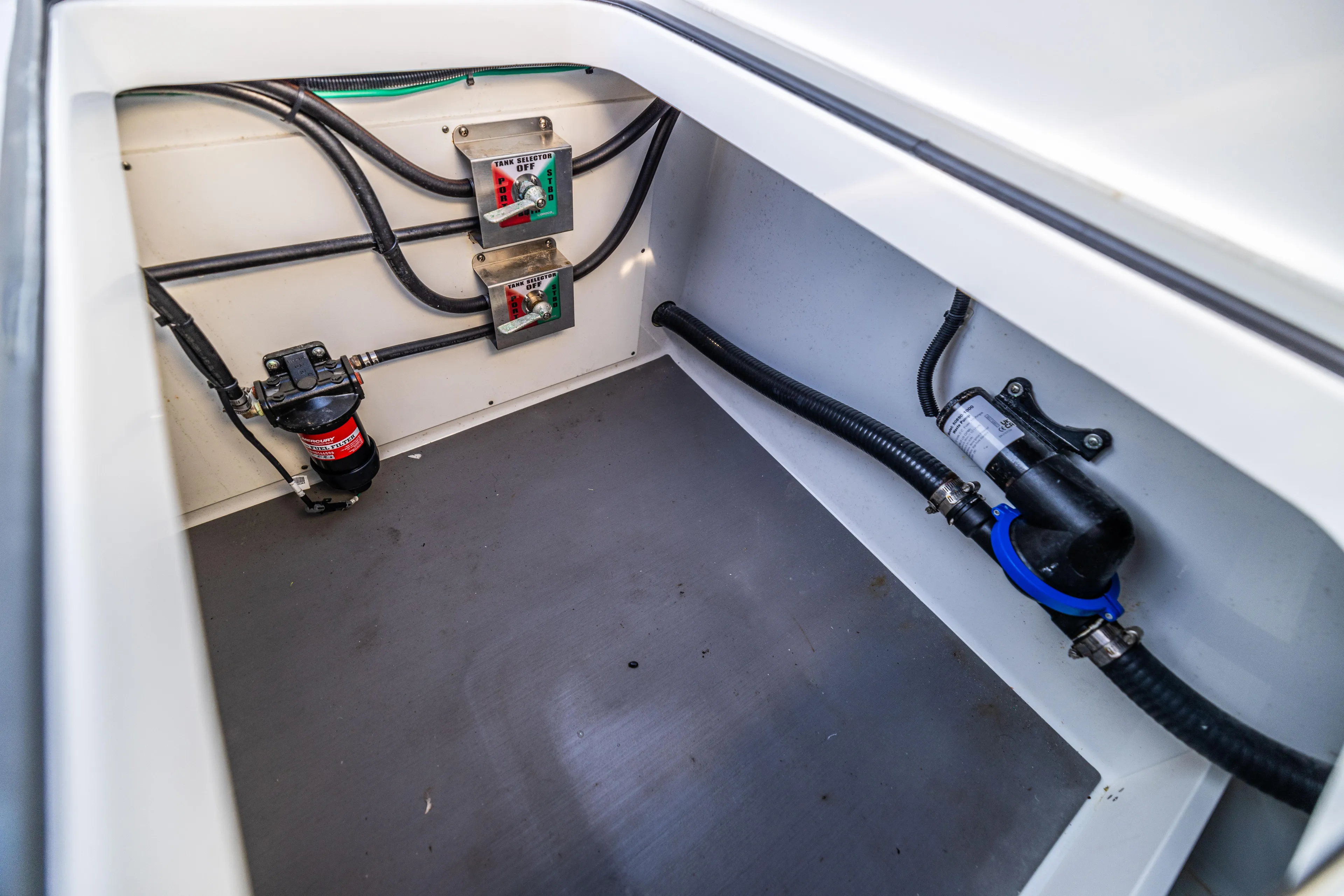  Yacht Photos Pics Freeman 42 LR 2022 boat compartment with wiring and pump system.