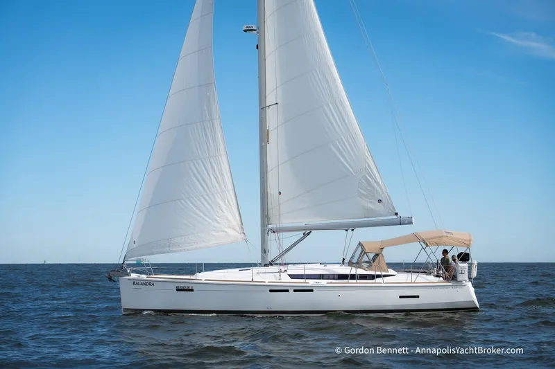 Balandra Yacht Photos Pics 2014 Jeanneau Sun Odyssey 439 sailing on open water under clear blue skies.