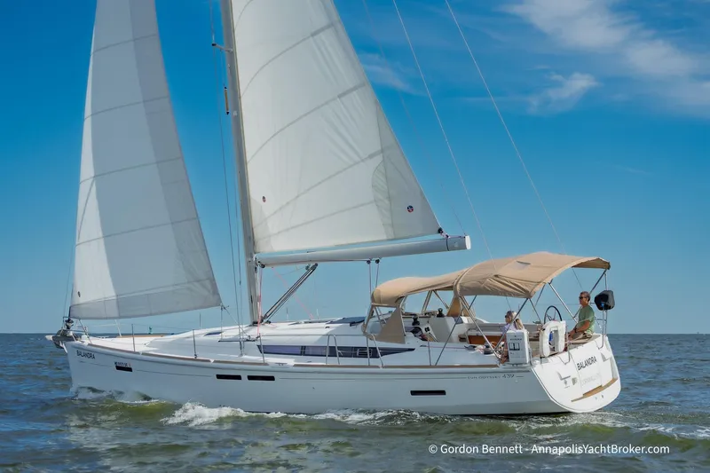 Balandra Yacht Photos Pics 2014 Jeanneau Sun Odyssey 439 sailing on open water under clear blue skies.