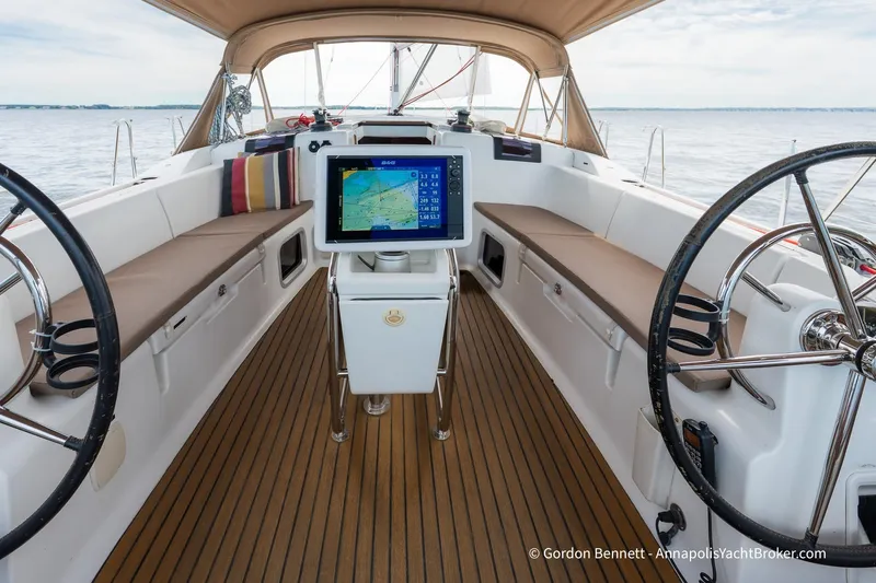 Balandra Yacht Photos Pics Cockpit of 2014 Jeanneau Sun Odyssey 439 sailboat with dual steering wheels and navigation display.