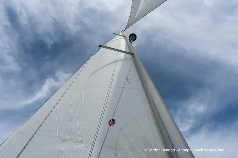 Balandra Yacht Photos Pics Sail of 2014 Jeanneau Sun Odyssey 439 against a cloudy sky.