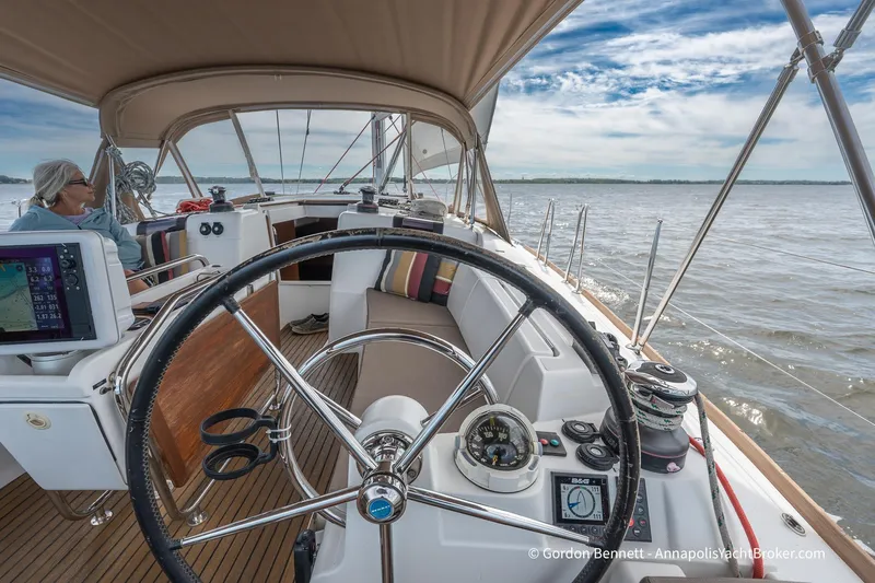 Balandra Yacht Photos Pics Cockpit view of 2014 Jeanneau Sun Odyssey 439 sailing yacht on open water.