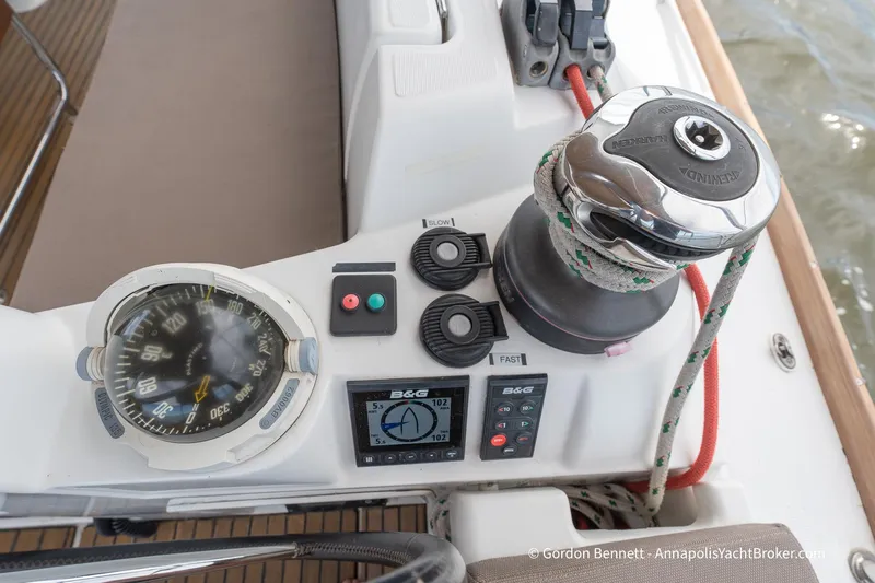 Balandra Yacht Photos Pics Cockpit controls of 2014 Jeanneau Sun Odyssey 439 sailboat, featuring compass and winch.