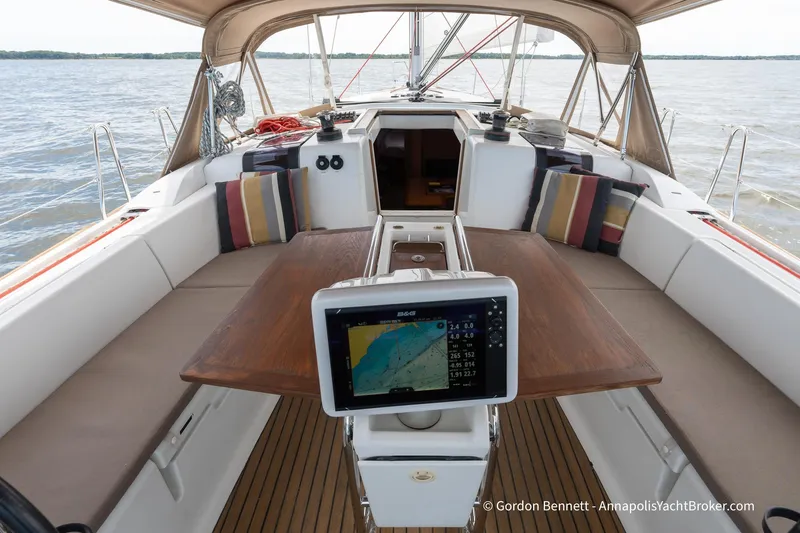 Balandra Yacht Photos Pics 2014 Jeanneau Sun Odyssey 439 yacht cockpit with navigation system and cushioned seating.