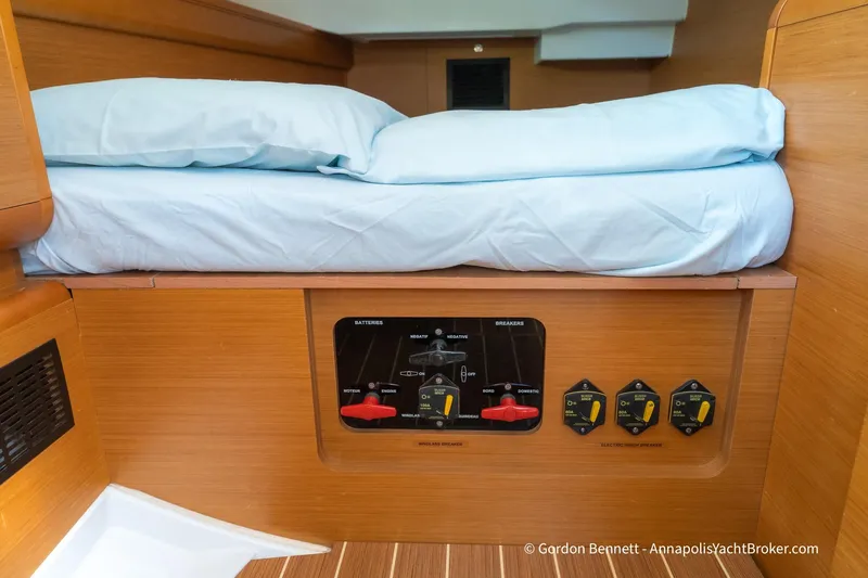 Balandra Yacht Photos Pics Interior of 2014 Jeanneau Sun Odyssey 439 yacht showing control panel under bed.