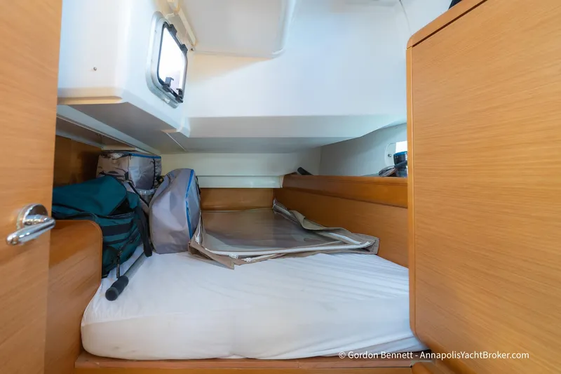 Balandra Yacht Photos Pics Cozy cabin interior of 2014 Jeanneau Sun Odyssey 439 yacht with storage and bedding.