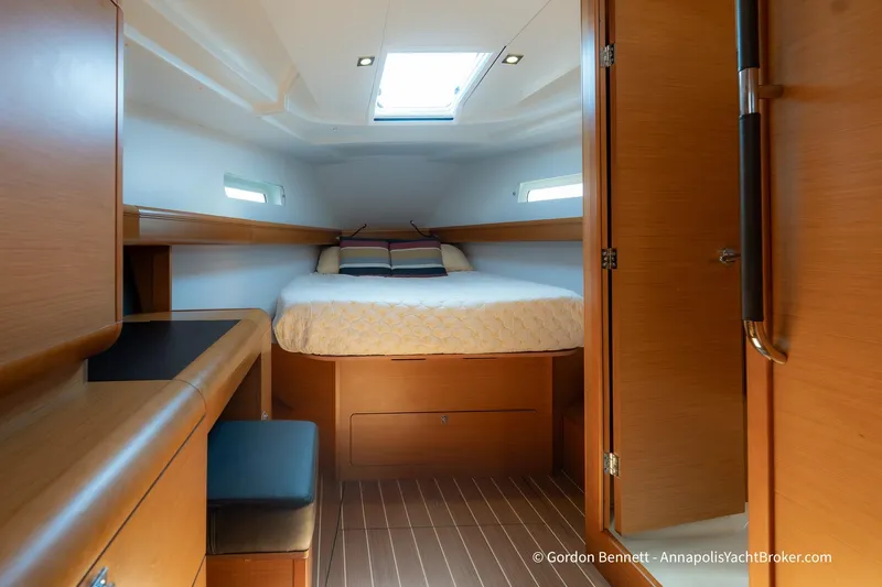 Balandra Yacht Photos Pics 2014 Jeanneau Sun Odyssey 439 cabin interior with bed, skylight, and wooden furnishings.