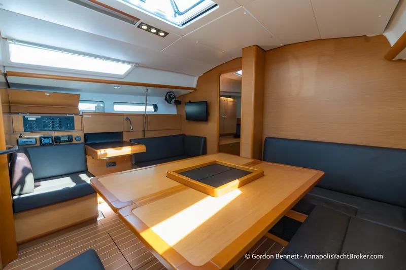 Balandra Yacht Photos Pics 2014 Jeanneau Sun Odyssey 439 interior with modern wood finish and seating area.