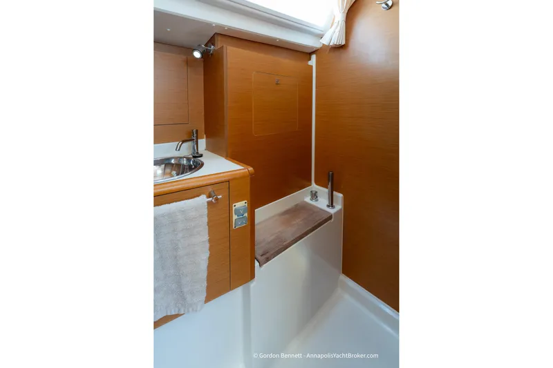 Balandra Yacht Photos Pics 2014 Jeanneau Sun Odyssey 439 yacht bathroom with wooden cabinetry and modern fixtures.