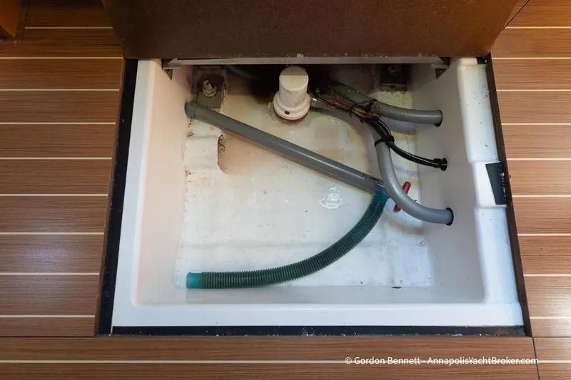 Balandra Yacht Photos Pics Bilge compartment of 2014 Jeanneau Sun Odyssey 439 yacht with visible hoses and pump.