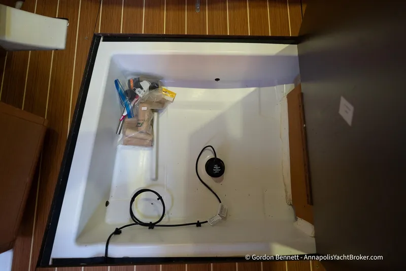 Balandra Yacht Photos Pics Storage compartment of 2014 Jeanneau Sun Odyssey 439 yacht with miscellaneous items.