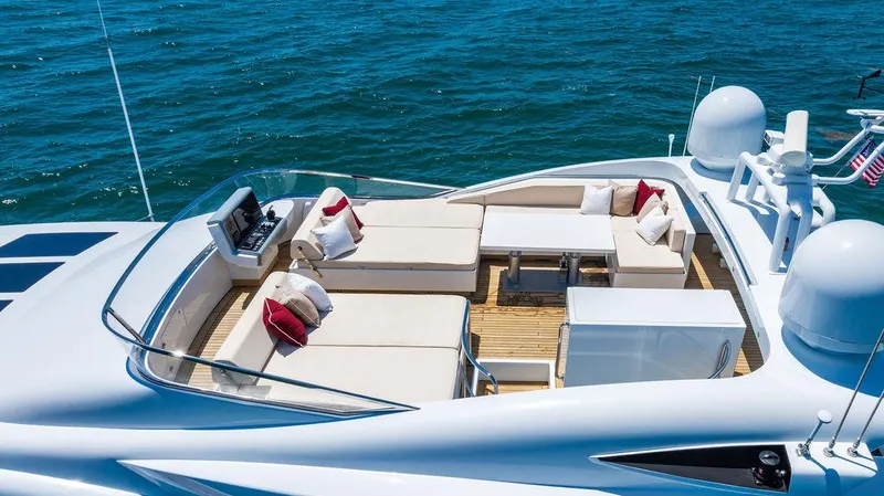 Mixed Emotions Yacht Photos Pics Luxurious 2014 Mangusta 110 yacht deck with elegant seating and ocean view.