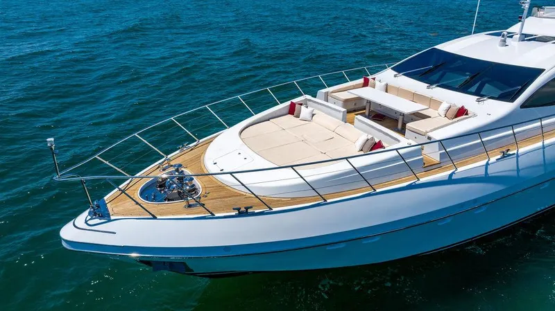 Mixed Emotions Yacht Photos Pics Luxurious 2014 Mangusta 110 yacht with spacious deck and elegant seating on the water.