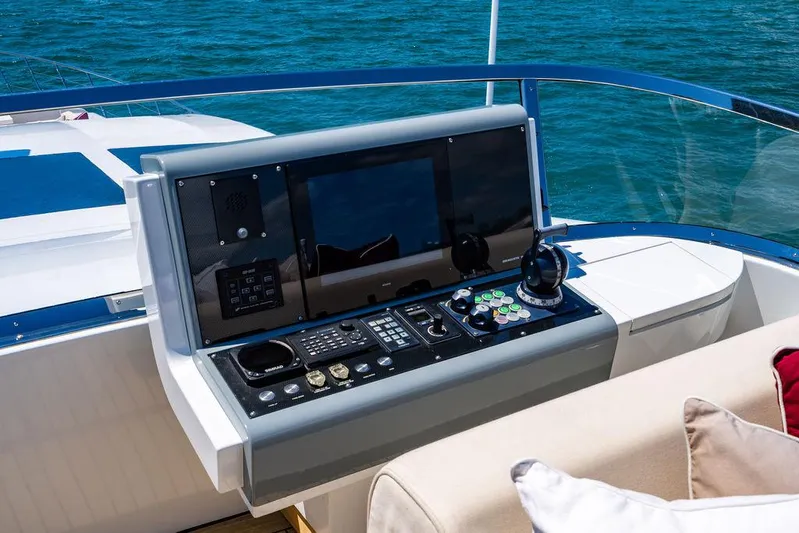 Mixed Emotions Yacht Photos Pics Control panel of a 2014 Mangusta 110 yacht with ocean view.