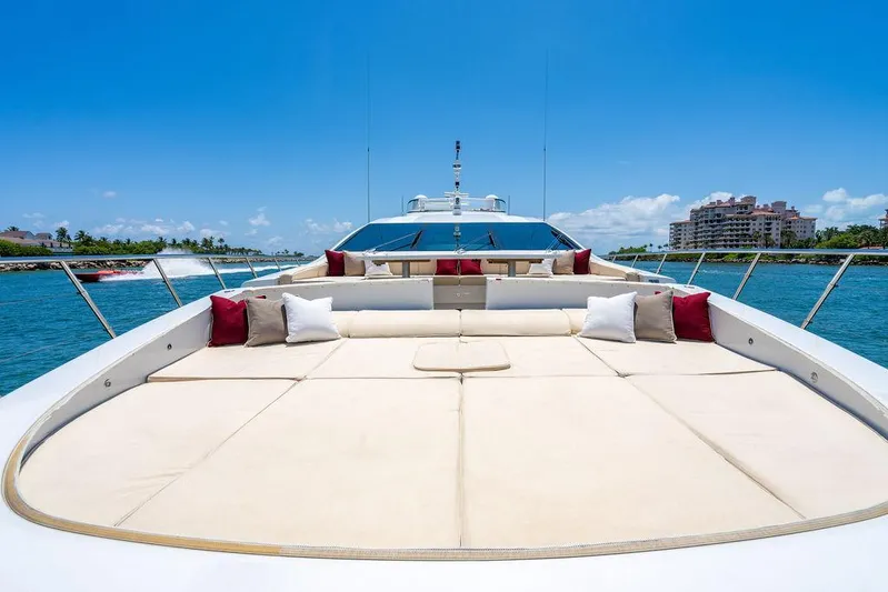 Mixed Emotions Yacht Photos Pics Luxurious 2014 Mangusta 110 yacht deck with plush seating and ocean view.