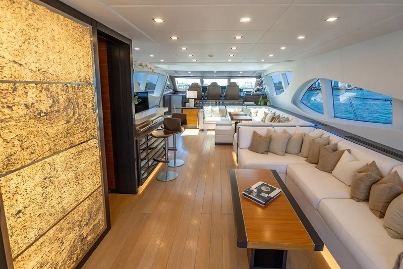 Mixed Emotions Yacht Photos Pics Luxurious interior of 2014 Mangusta 110 yacht with elegant seating and modern design.