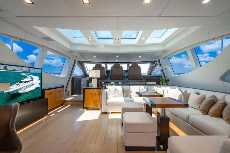 Mixed Emotions Yacht Photos Pics Luxurious interior of 2014 Mangusta 110 yacht with skylights and modern furnishings.