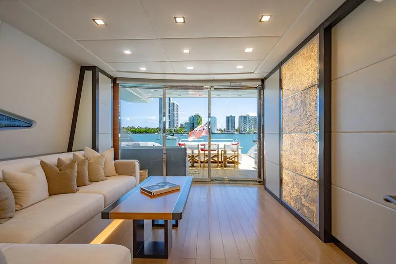 Mixed Emotions Yacht Photos Pics Luxurious interior of 2014 Mangusta 110 yacht with modern decor and waterfront view.