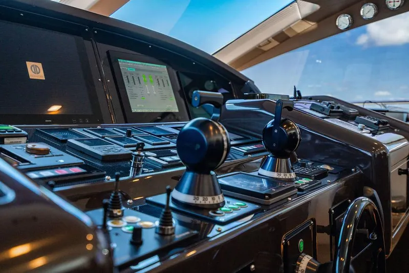 Mixed Emotions Yacht Photos Pics Control panel of a 2014 Mangusta 110 yacht with advanced navigation systems.