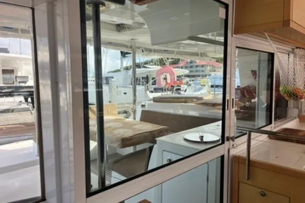 Searching For Bliss Yacht Photos Pics Interior view of 2011 Lagoon 450 F catamaran, featuring a cozy dining area and modern design.