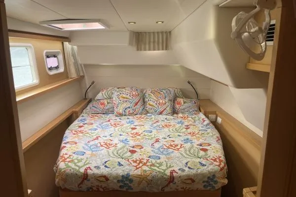 Searching For Bliss Yacht Photos Pics Cozy bedroom in 2011 Lagoon 450 F yacht with colorful bedding and natural light.