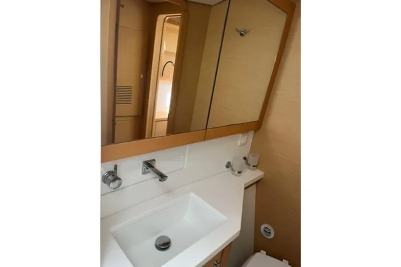 Searching For Bliss Yacht Photos Pics Bathroom interior of 2011 Lagoon 450 F yacht with modern sink and mirror.