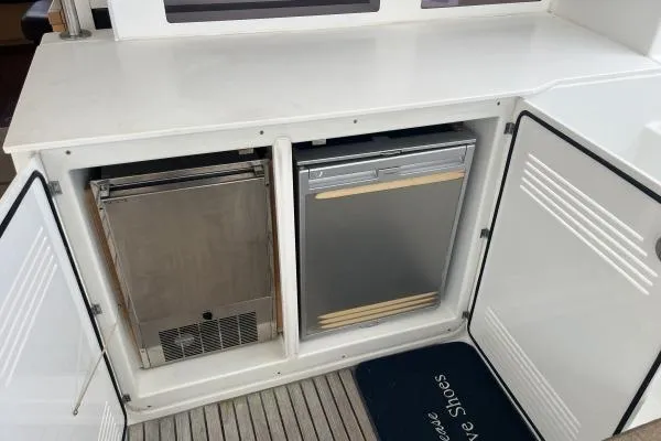 Searching For Bliss Yacht Photos Pics Outdoor storage compartment with appliances on a 2011 Lagoon 450 F yacht.