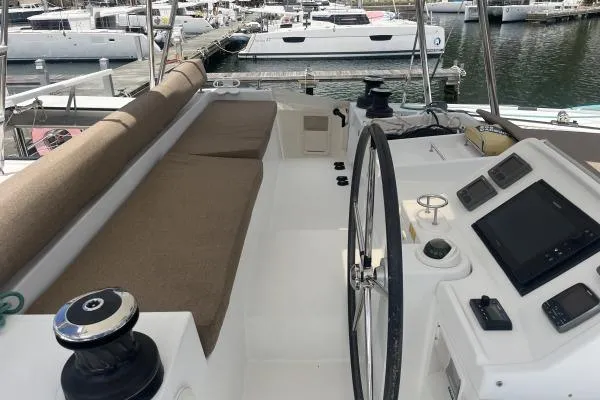 Searching For Bliss Yacht Photos Pics Helm of 2011 Lagoon 450 F catamaran with navigation equipment and seating.