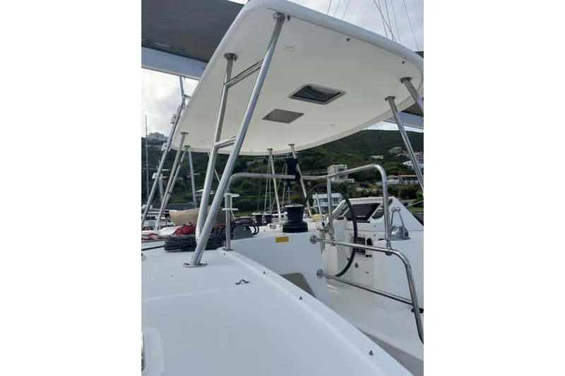 Searching For Bliss Yacht Photos Pics Lagoon 450 F catamaran deck view, showcasing helm and rigging, 2011 model.