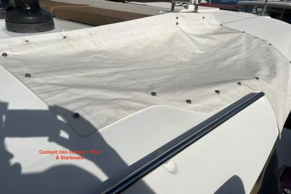 Searching For Bliss Yacht Photos Pics Cockpit rain cover on 2011 Lagoon 450 F yacht, port and starboard view.