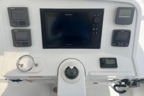 Searching For Bliss Yacht Photos Pics Control panel of 2011 Lagoon 450 F catamaran with navigation instruments.