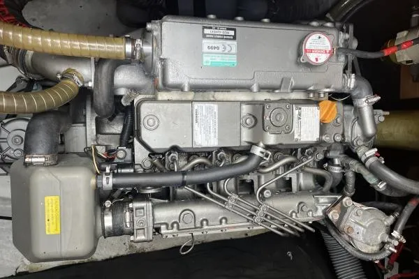 Searching For Bliss Yacht Photos Pics Engine of a 2011 Lagoon 450 F catamaran, showcasing intricate mechanical components.