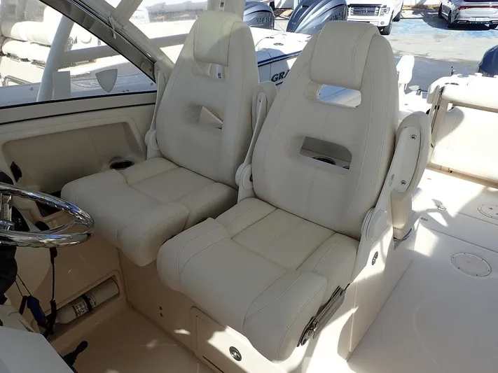  Yacht Photos Pics 2019 Grady-White Freedom 325 boat interior with two plush white seats.