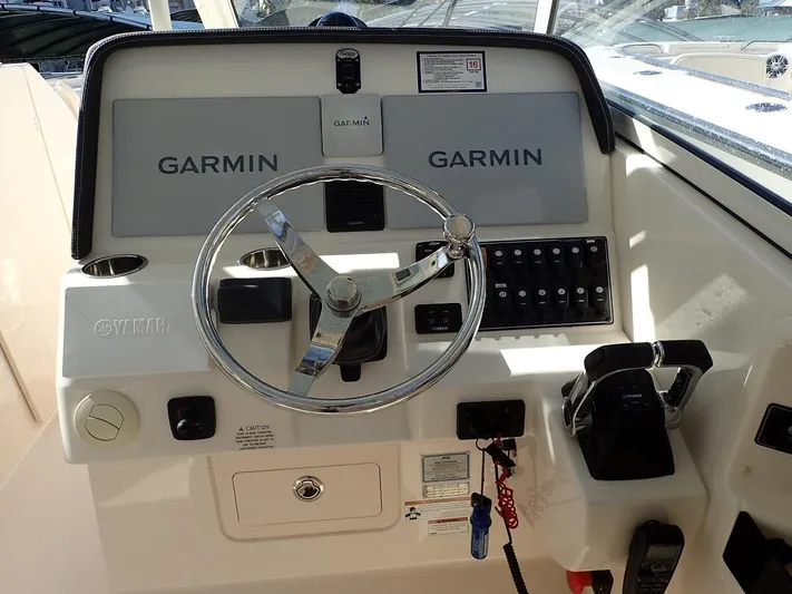  Yacht Photos Pics 2019 Grady-White Freedom 325 helm with Garmin navigation and control panel.