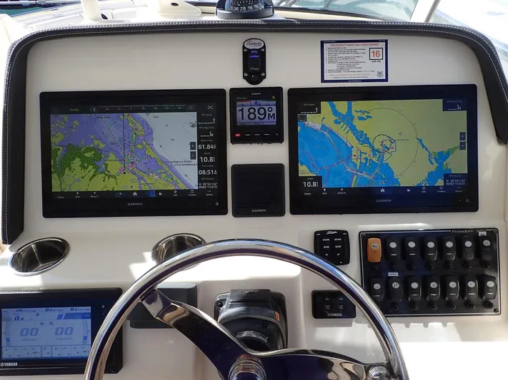  Yacht Photos Pics Helm of 2019 Grady-White Freedom 325 with navigation screens and controls.