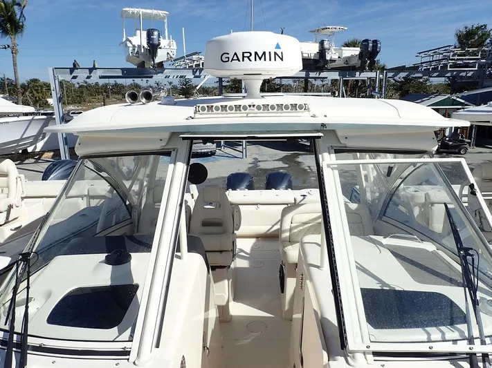  Yacht Photos Pics 2019 Grady-White Freedom 325 boat with Garmin navigation system, open cockpit view.