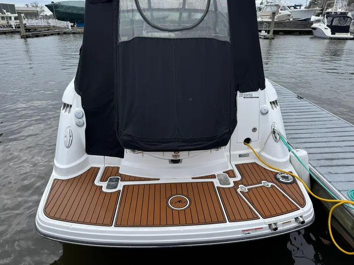  Yacht Photos Pics 2020 Monterey 295 Sport Yacht docked, featuring a sleek rear deck design.