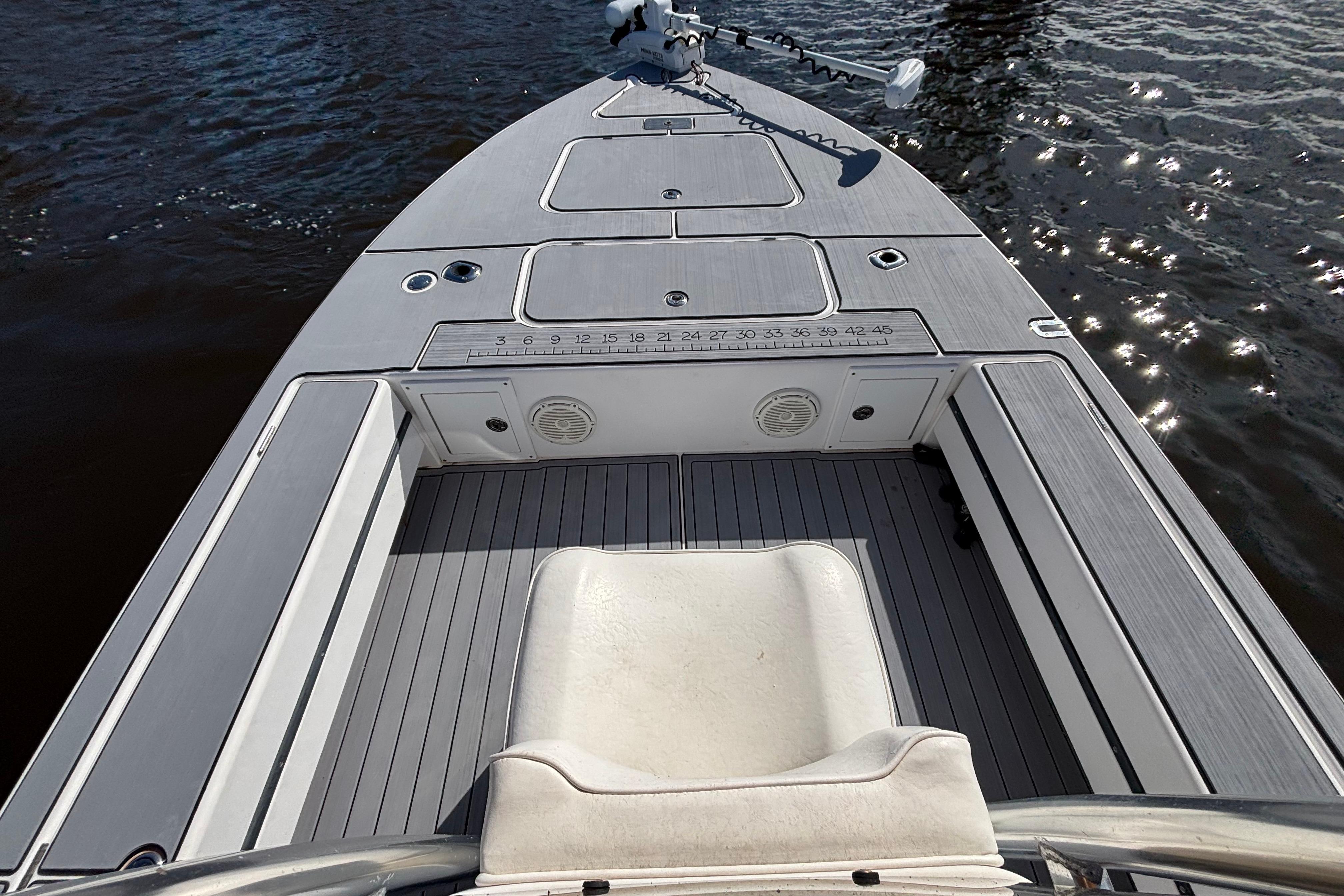 2008 Release Tarpon Bay boat deck with seating, on calm water.