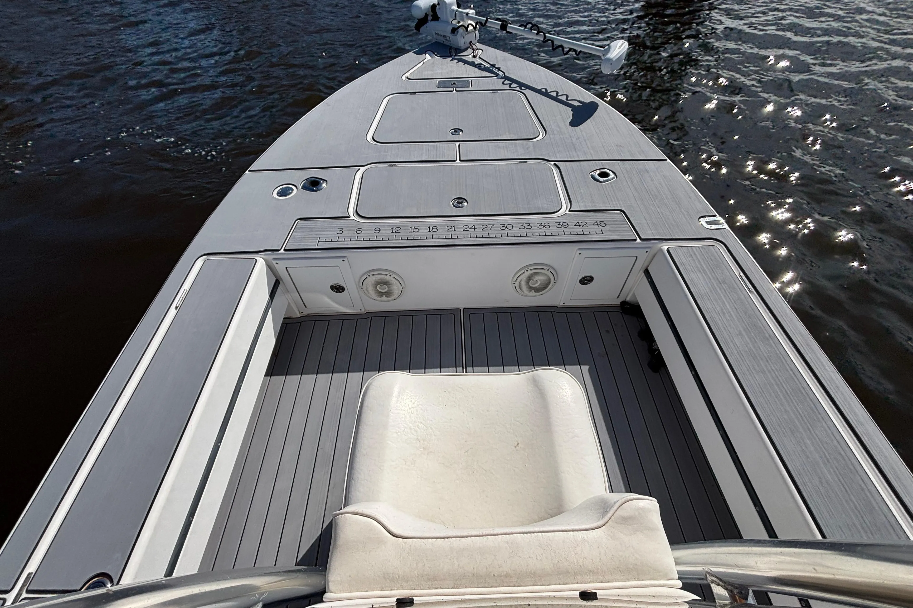 2008 Release Tarpon Bay boat deck with seating, on calm water.