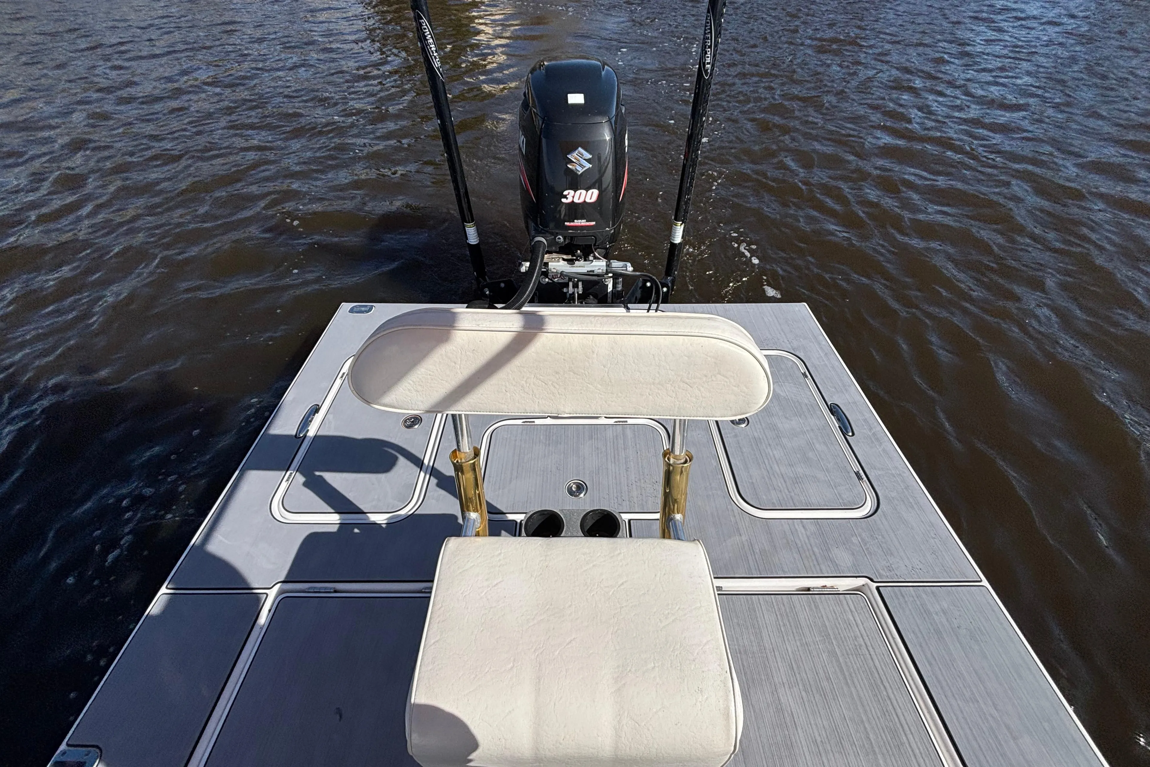 2008 Release Tarpon Bay boat with Suzuki 300 engine on water.
