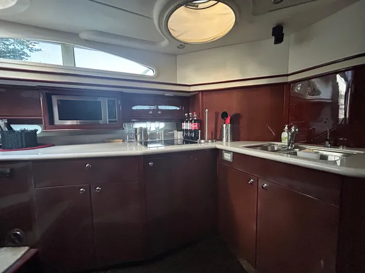  Yacht Photos Pics Luxurious kitchen interior of 2006 Neptunus 55 Cabrio yacht with modern amenities.