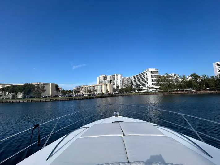  Yacht Photos Pics Bow view from 2006 Neptunus 55 Cabrio yacht, city skyline in background.