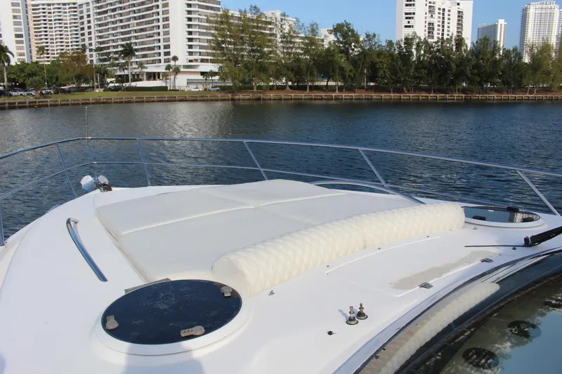  Yacht Photos Pics Bow view of 2006 Neptunus 55 Cabrio yacht with cityscape background.