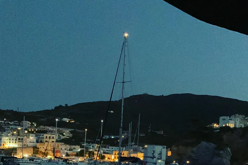 Arma Di Re Yacht Photos Pics Sailboat in a harbor at dusk, featuring a 1983 Hallberg-Rassy 42E.