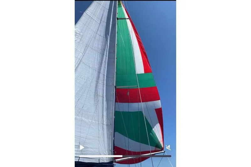 Arma Di Re Yacht Photos Pics Sails of a 1983 Hallberg-Rassy 42E yacht against a clear blue sky.