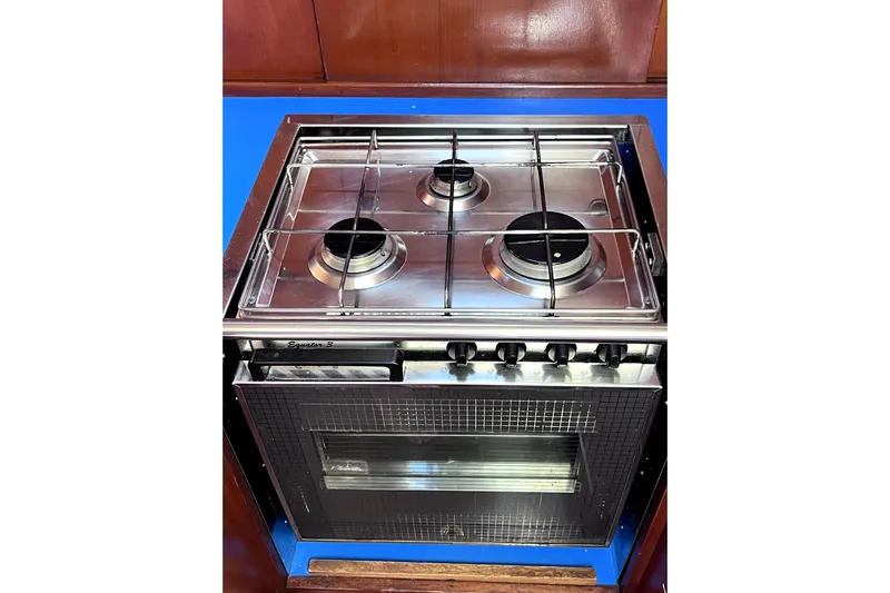 Arma Di Re Yacht Photos Pics Stainless steel stove and oven in 1983 Hallberg-Rassy 42E yacht kitchen.