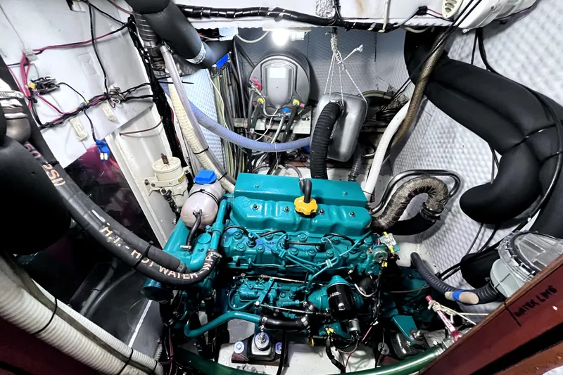 Arma Di Re Yacht Photos Pics Engine room of a 1983 Hallberg-Rassy 42E sailboat, showcasing a well-maintained engine.